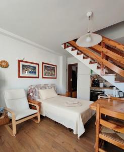 a bedroom with a bed and a staircase at Casa Giuseppina in Temù +18 photos