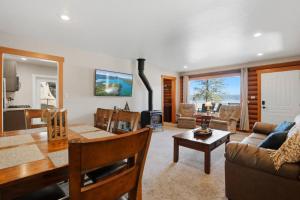 a living room with a couch and a table at Hayden Lake Oasis in Hayden