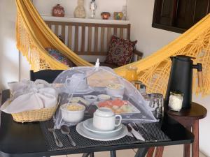 a tray of food on top of a table at Pousada Du’Forte in Praia do Forte