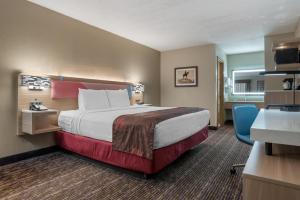 a hotel room with a large bed and a desk at Best Western Vicksburg in Vicksburg +23 photos