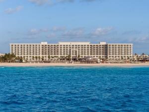 a large hotel on a beach with the ocean at Hyatt Zilara Cancun - All Inclusive - Adults Only in Cancún
