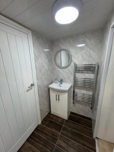 a bathroom with a sink and a mirror at The Dublin Packet Double Room Number 8 in Holyhead