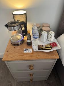 a table with a coffee maker on top of a bed at The Dublin Packet Double Room Number 8 in Holyhead