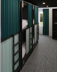 a room with three bunk beds in a room at Auberge du Parc in Delémont +2 photos