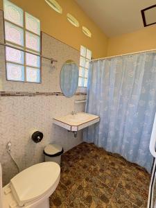 a bathroom with a toilet and a sink and a shower at Rimlay Bay View 2 in Ko Yao Noi +59 photos