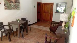 a dining room with a table and chairs at Residencial De Rosas in Santiago