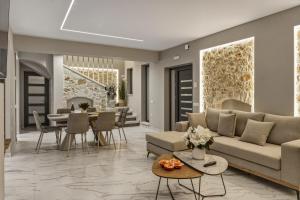 a living room with a couch and a table at Moon and Sun in Vamos