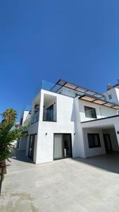 a large white building with a lot of windows at Bodrum has apart otel in Bodrum City