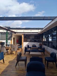 a patio with couches and chairs on a building at Hazie Hotel in Lagos