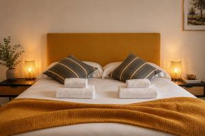 a large bed with two towels on top of it at Il Sottolo in Florence