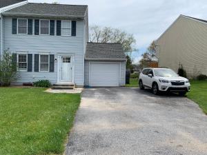 a white car parked in front of a house at School Village Walk-in shower and jetted tub in Elizabethtown