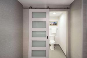a bathroom with a white toilet in a room at Cape Cod Family Resort and Parks in West Yarmouth