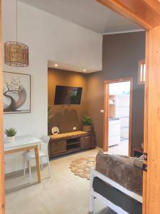 a living room with a couch and a table at Caribbean Lory in Puerto Viejo