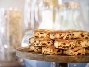 a pile of cookies sitting on top of a table at Hotel Grand Tela Suite Delhi in Gurgaon +30 photos
