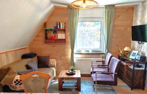 a living room with a couch and chairs and a window at YALET Ferienhaus 2 appartementen vlakbij Willingen in Brilon-Wald