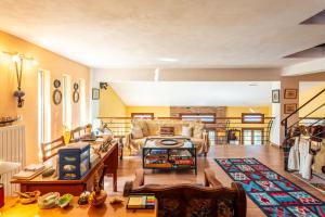 a living room with a couch and a table at Heritage Ridge in Skroponeria