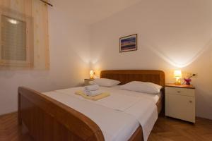 Ein Bett oder Betten in einem Zimmer der Unterkunft Apartmani Gaube