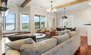 a living room with a large couch and a table at Emerald Bay Unit 1B in Lake Ozark +22 photos