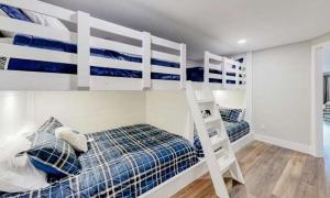 a bedroom with two bunk beds and a ladder at Lake Ozarks in Rocky Mount