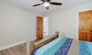 a bedroom with a bed and a ceiling fan at Lake Ozarks in Rocky Mount +33 photos