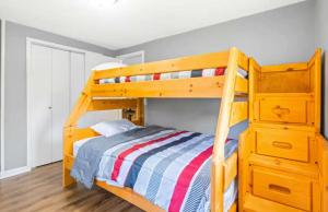 a bedroom with a wooden bunk bed with a dresser at Eternal Sunrises in Sunrise Beach +21 photos