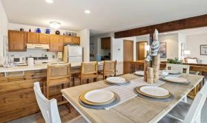 a kitchen and dining room with a table and chairs at Pelican Bay Getaway in Lake Ozark