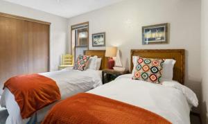 a bedroom with two beds and a window at Pelican Bay Getaway in Lake Ozark