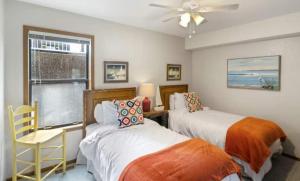 a bedroom with two beds and a window at Pelican Bay Getaway in Lake Ozark