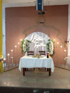 a table with a white table cloth and a sign at Gabala Semerana Hotel Cottage in Gabala +109 photos