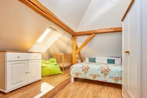 a bedroom with a bed in a attic at Villa Harmony in Český Krumlov