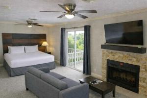 a hotel room with a bed and a fireplace at Annabell Gardens in Lincoln +43 photos