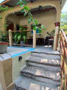 a house with stairs leading to the front yard at A 7 min de Palmerola, Aire acondicionado, Wifi y Parqueo in Comayagua