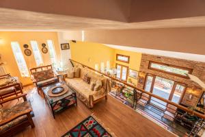 a living room with a couch and a table at Heritage Ridge in Skroponeria