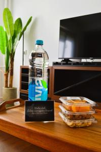 a bottle of water sitting on top of a table at Apartman Vera in Prijedor