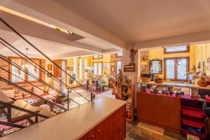 a kitchen with a staircase and a living room at Heritage Ridge in Skroponeria