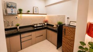 a kitchen with a sink and a counter at Sylevo 2bhk kharadi in Pune