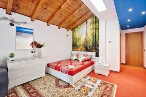 a bedroom with a red bed and a painting on the wall at Jolly Private Room in Marghera +8 photos