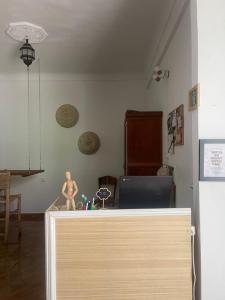 a mannequin sitting on a table in a room at Syrah Home in Tangier