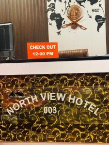 a sign for a north view hotel on a shelf at Northview Hotel Hunza in Hunza Valley
