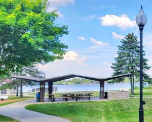 a picnic shelter in a park near the water at Welcome to Bluebird Cottage in Lakeview