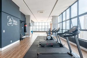 a gym with a treadmill and a exercise bike at Full Apartment with Pool and Gym - M1605 in Recife