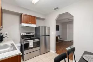 a kitchen with a stainless steel refrigerator and a sink at Silver Springs Retreat in Silver Springs