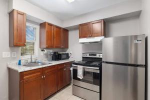 a kitchen with wooden cabinets and a stainless steel refrigerator at Silver Springs Retreat in Silver Springs