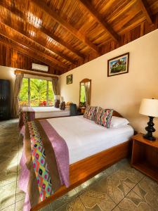 a bedroom with two beds in a room at Hotel Villas Vilma in Fortuna +63 photos