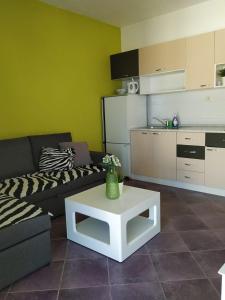 a living room with a couch and a table at toni in Makarska
