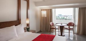 Voodi või voodid majutusasutuse Eko Hotel Main Building toas