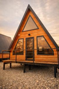 a tiny house with a triangular roof at Lake Cottages in Grigoleti