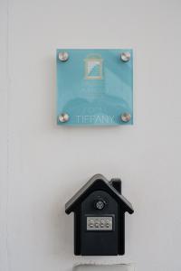 a sign on a wall with a clock on it at Palazzo Ambrosio in Nola
