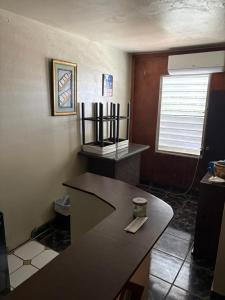 a kitchen with a counter top and a window at Joe's Studio in San Juan +8 photos