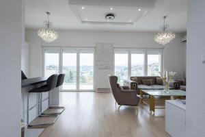 a living room with a couch and a table at Lumina Residence in Sarajevo